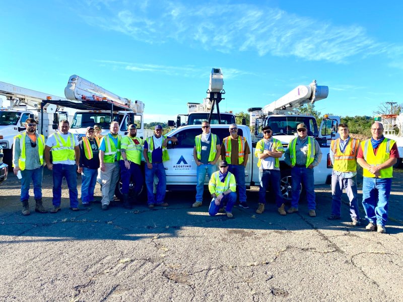 Group of Agostino Utilities Workers with Branded Truck